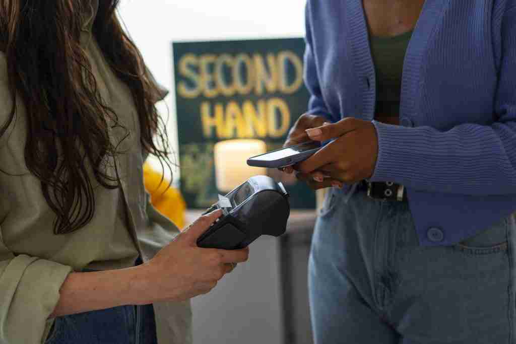 side view woman paying with card