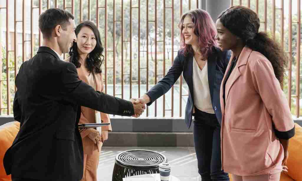 medium shot man woman shaking hands